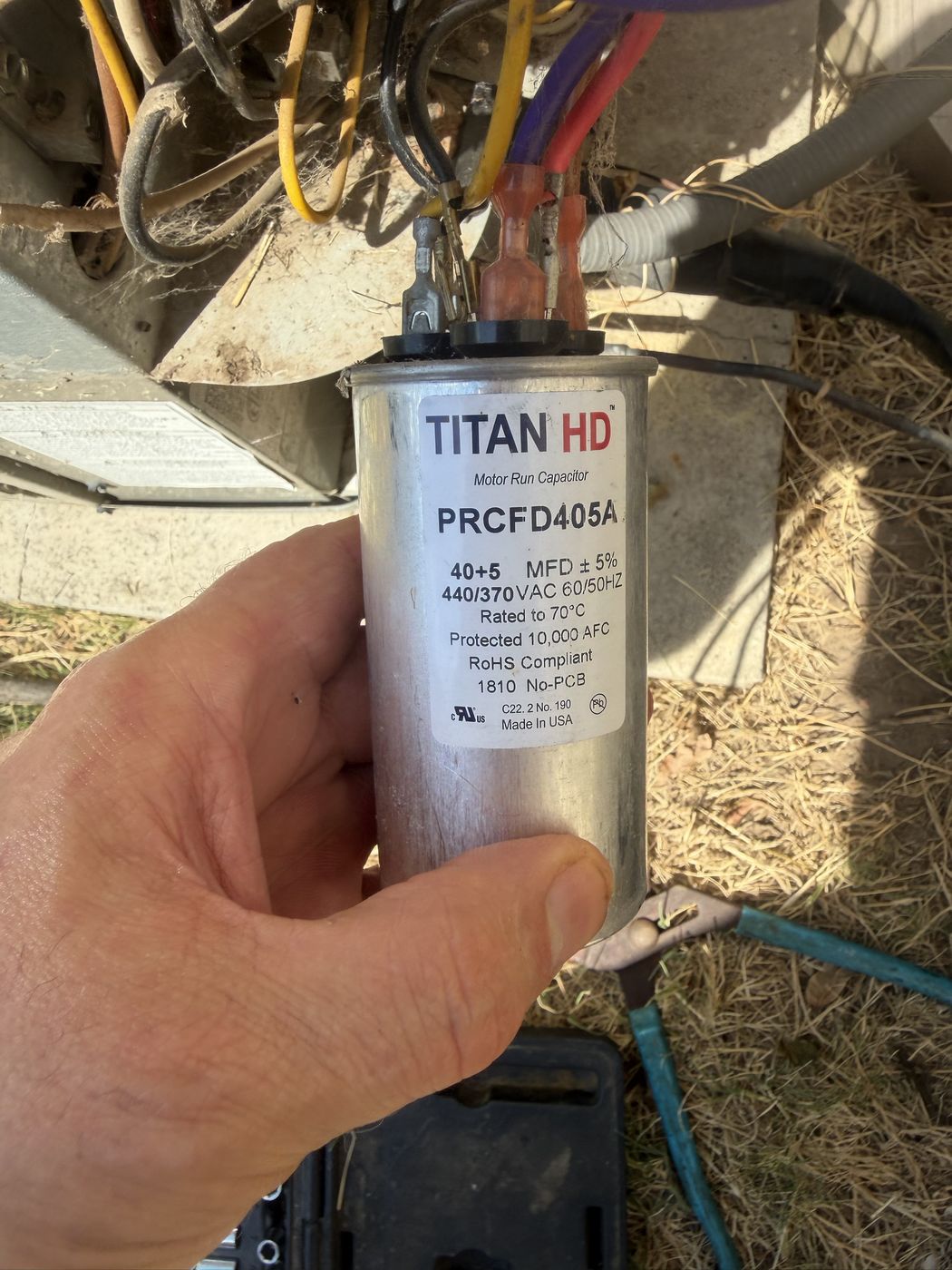 The capacitor label showing 40 plus 5 MFD and 440 VAC