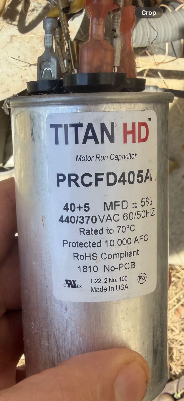 Close up of the capacitor label with the ratings clearly readable