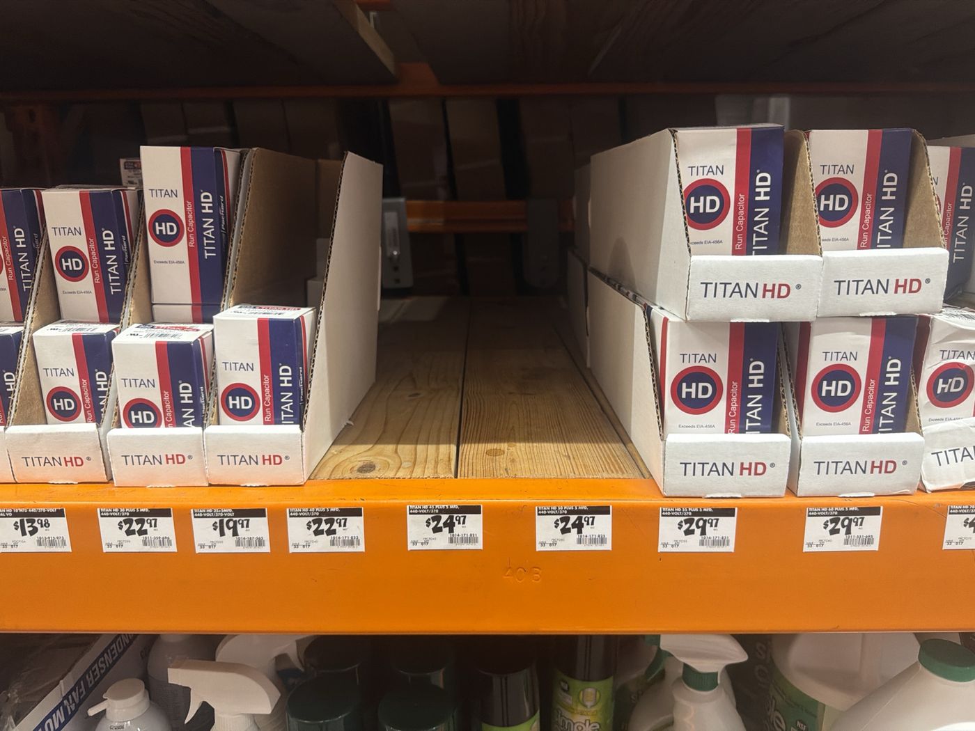 The store shelf with capacitors in stock and empty holes where three sizes should be, including the 40 plus 5